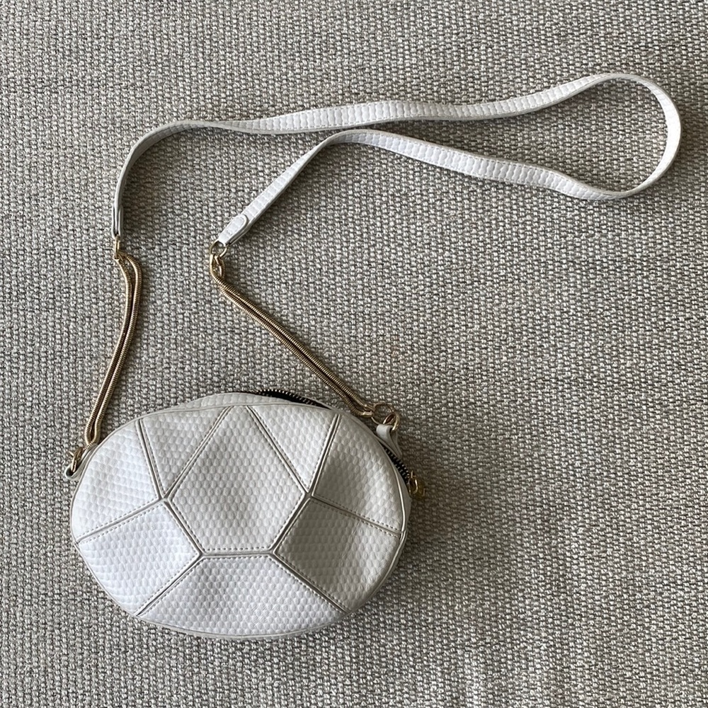 White geometric crossbody bag with gold hardware